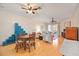 Open dining area with light wood floors and a round wooden table at 4209 Cascade Falls Dr, Sarasota, FL 34243
