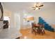 Bright dining area with wood floors, a round table, and built-in cabinetry at 4209 Cascade Falls Dr, Sarasota, FL 34243