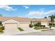 Two-unit home with attached garages and manicured landscaping at 4209 Cascade Falls Dr, Sarasota, FL 34243
