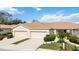 Two-unit home with attached garages and manicured landscaping at 4209 Cascade Falls Dr, Sarasota, FL 34243