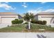 Front view of two-unit building with landscaping at 4209 Cascade Falls Dr, Sarasota, FL 34243