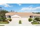 Two-unit home with attached garages and manicured landscaping at 4209 Cascade Falls Dr, Sarasota, FL 34243