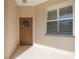 Inviting front entrance with a brown door and a charming wreath at 4209 Cascade Falls Dr, Sarasota, FL 34243