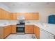 Well-equipped kitchen featuring light wood cabinets and modern appliances at 4209 Cascade Falls Dr, Sarasota, FL 34243
