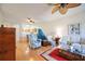 Bright living room with hardwood floors and a view into the dining area at 4209 Cascade Falls Dr, Sarasota, FL 34243