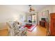 Relaxing living room with light colored sofa and access to a patio at 4209 Cascade Falls Dr, Sarasota, FL 34243