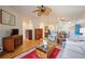 Spacious living room with hardwood floors and a view of the kitchen and patio at 4209 Cascade Falls Dr, Sarasota, FL 34243