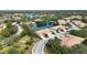 Aerial view showing a desirable neighborhood with houses surrounding a lake at 4209 Cascade Falls Dr, Sarasota, FL 34243