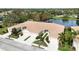 Quadruplex with tile roofs and lush landscaping near lake at 4209 Cascade Falls Dr, Sarasota, FL 34243