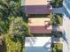 Aerial perspective of three homes with terracotta roofs at 4210 65Th E Ter, Sarasota, FL 34243