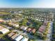 Aerial view of a house near a pond in a residential area at 4210 65Th E Ter, Sarasota, FL 34243