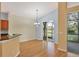 Bright dining room with wood floors and access to a screened patio at 4210 65Th E Ter, Sarasota, FL 34243