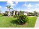 One-story house with palm trees and manicured lawn at 5384 Layton Dr, Venice, FL 34293