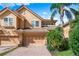 Two-story townhome with a two-car garage and attractive landscaping at 5531 Napa Dr, Sarasota, FL 34243