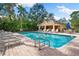 Inviting community pool with a relaxing poolside area at 5531 Napa Dr, Sarasota, FL 34243