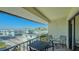 Private balcony with seating offers a charming view of the surrounding coastal community at 601 Gulf N Dr # 209, Bradenton Beach, FL 34217