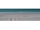 White sand beach with ocean waves at 601 Gulf N Dr # 209, Bradenton Beach, FL 34217