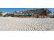 Beachfront restaurant with thatched roofs and outdoor seating at 601 Gulf N Dr # 209, Bradenton Beach, FL 34217