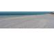 Wide sandy beach with ocean waves at 601 Gulf N Dr # 209, Bradenton Beach, FL 34217