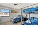 Bedroom with twin beds, bunk beds, and ocean views at 601 Gulf N Dr # 209, Bradenton Beach, FL 34217