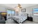 Main bedroom with king bed, balcony access and ocean view at 601 Gulf N Dr # 209, Bradenton Beach, FL 34217