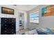 Bedroom with dresser, ocean view, and twin bed at 601 Gulf N Dr # 209, Bradenton Beach, FL 34217