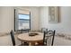 Small dining area with round table and four chairs at 601 Gulf N Dr # 209, Bradenton Beach, FL 34217