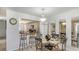 Small dining area with glass table and kitchen access at 601 Gulf N Dr # 209, Bradenton Beach, FL 34217