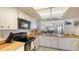 Kitchen with view into living and dining areas at 601 Gulf N Dr # 209, Bradenton Beach, FL 34217
