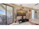 Cozy living room with a flat screen TV and sliding glass doors to a private balcony at 601 Gulf N Dr # 209, Bradenton Beach, FL 34217
