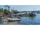 Boats docked at a marina on a sunny day at 601 Gulf N Dr # 209, Bradenton Beach, FL 34217