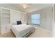 Bedroom with a built-in wall bed and ample shelving at 6705 Grand Estuary Trl # 206, Bradenton, FL 34212