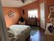 Comfortable bedroom with a double bed and dresser at 8400 Princess Ct, Palmetto, FL 34221