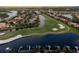Aerial view of upscale community with golf course, waterways, and luxury homes at 918 River Basin Ct # 101A, Bradenton, FL 34212