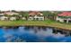 Community features lakefront homes with lush landscaping and a tranquil setting at 918 River Basin Ct # 101A, Bradenton, FL 34212