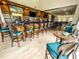 Upscale bar with teal chairs and a large counter at 918 River Basin Ct # 101A, Bradenton, FL 34212
