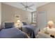 Twin beds, ceiling fan, and access to a bathroom at 918 River Basin Ct # 101A, Bradenton, FL 34212