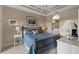 Spacious bedroom with a king-size bed and ensuite bathroom access at 918 River Basin Ct # 101A, Bradenton, FL 34212