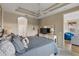 King-size bed, dresser, and view of additional sitting area at 918 River Basin Ct # 101A, Bradenton, FL 34212