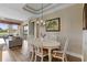 Elegant dining room with a white oval table and six chairs at 918 River Basin Ct # 101A, Bradenton, FL 34212