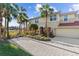Two-story townhome with attractive landscaping and a paved driveway at 918 River Basin Ct # 101A, Bradenton, FL 34212