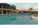 Community pool with a clubhouse in the background at 918 River Basin Ct # 101A, Bradenton, FL 34212