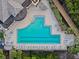 Resort-style pool with plenty of lounge chairs at 918 River Basin Ct # 101A, Bradenton, FL 34212