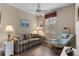 Cozy sitting room featuring a plaid sofa and comfortable armchair at 918 River Basin Ct # 101A, Bradenton, FL 34212