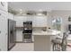 Modern kitchen featuring stainless steel appliances and white cabinetry at 9606 Sea Turtle Ter # 102, Bradenton, FL 34212