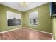 bedroom with wood floors and mountain wall art at 10813 56Th E St, Parrish, FL 34219