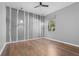 Bright bedroom with wood floors and tree-themed wall art at 10813 56Th E St, Parrish, FL 34219