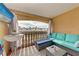 Balcony with seating and partial ocean view at 115 Tyler Dr # 203, Sarasota, FL 34236