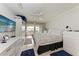 Spacious bedroom with king-size bed and private balcony at 115 Tyler Dr # 203, Sarasota, FL 34236