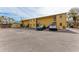 Rear view of building with parking and access at 115 Tyler Dr # 203, Sarasota, FL 34236